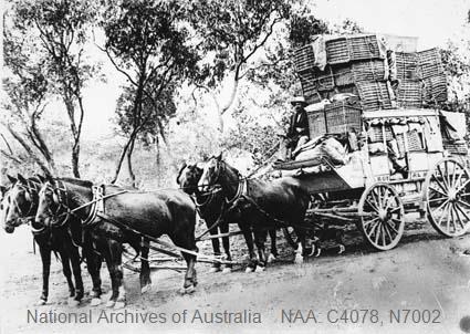 Horse drawn Cobb nd Co coach with baskets of mail